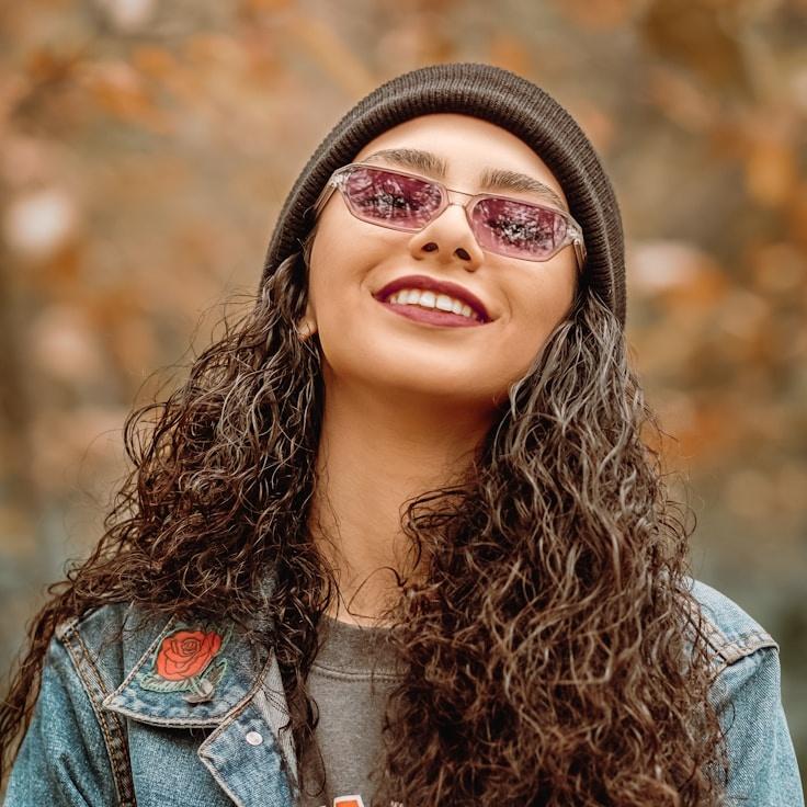 Kaveri Mehta, Lead Design Curator at Haven Ridge Orchard, reviewing corporate floral arrangements